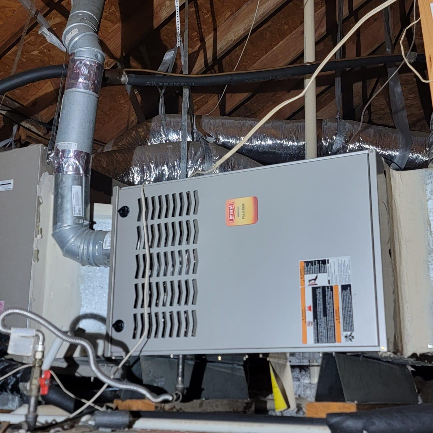 Furnace Repair by <a href= Professional HVAC technician repairing a furnace in Houston TX