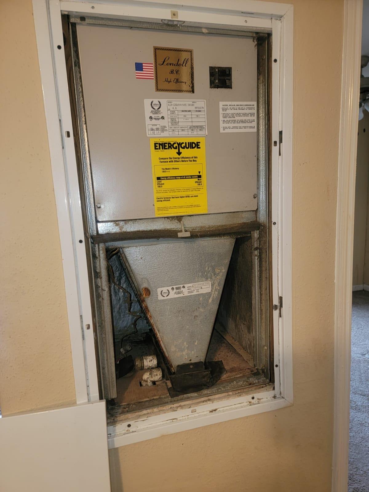 <a href= Vintage thermostat in a Houston home showcasing professional HVAC services