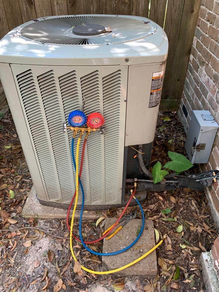 Furnace Repair by <a href= Professional HVAC technician repairing a furnace in Houston TX