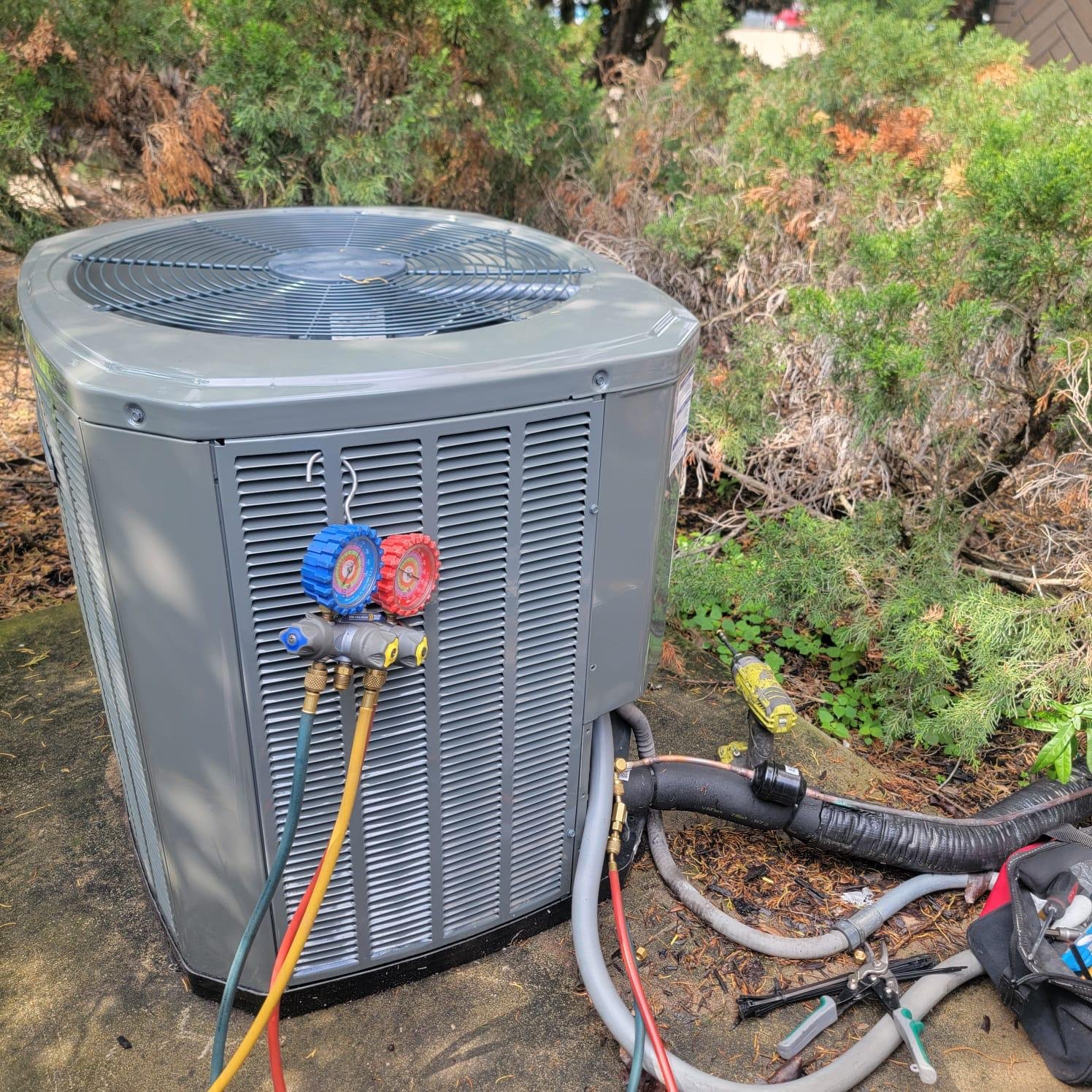 AC Technician Repairing Unit in Southbelt Ellington 77075