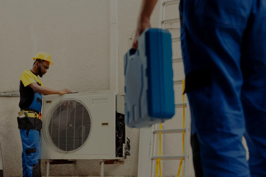 Professional HVAC technician servicing an air conditioning unit perfect for HVAC repair and maintenance services
