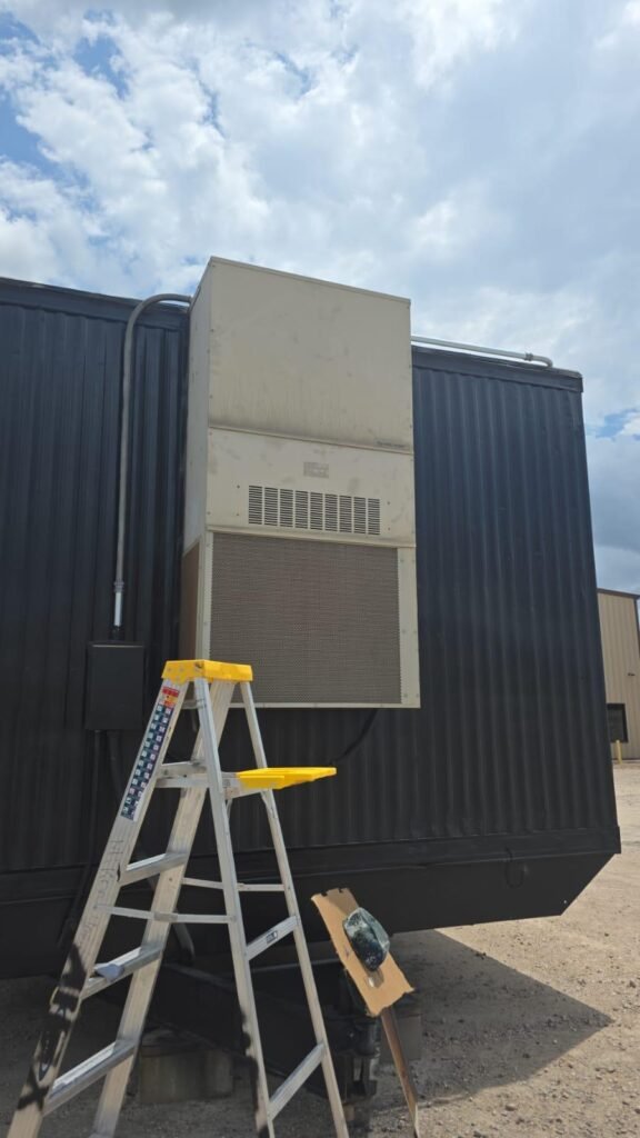 Technician performing garage door repair service in Houston TX