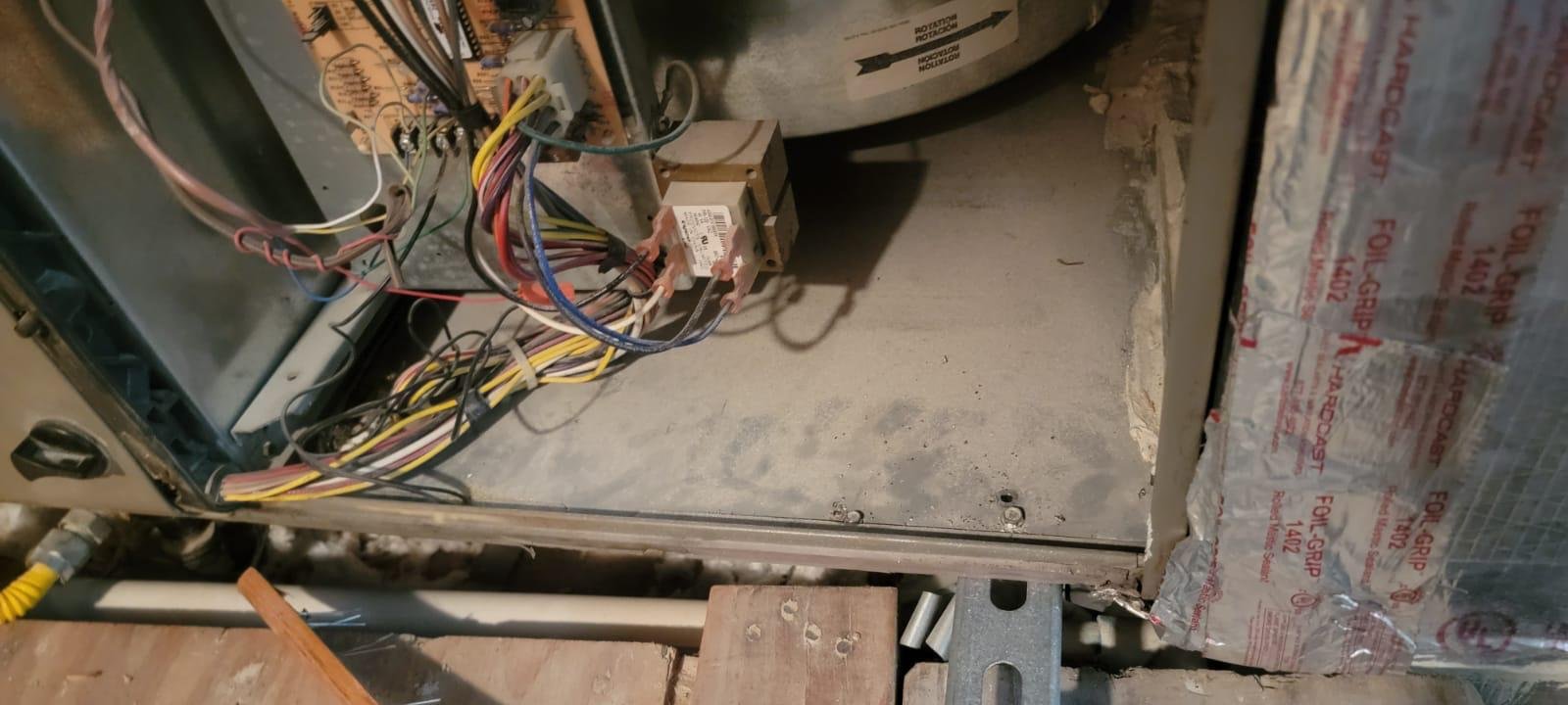 Professional HVAC technician repairing wiring in Houston TX